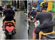 Con gái nhỏ chui vào áo bố tránh mưa